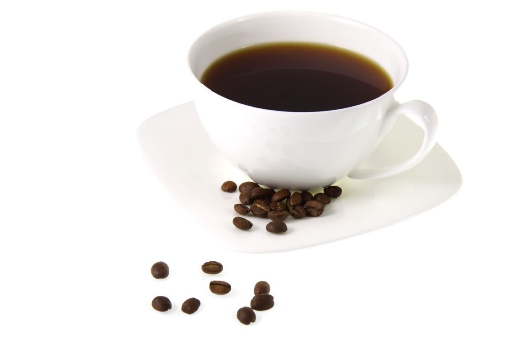 Cup of Americano coffee with beans